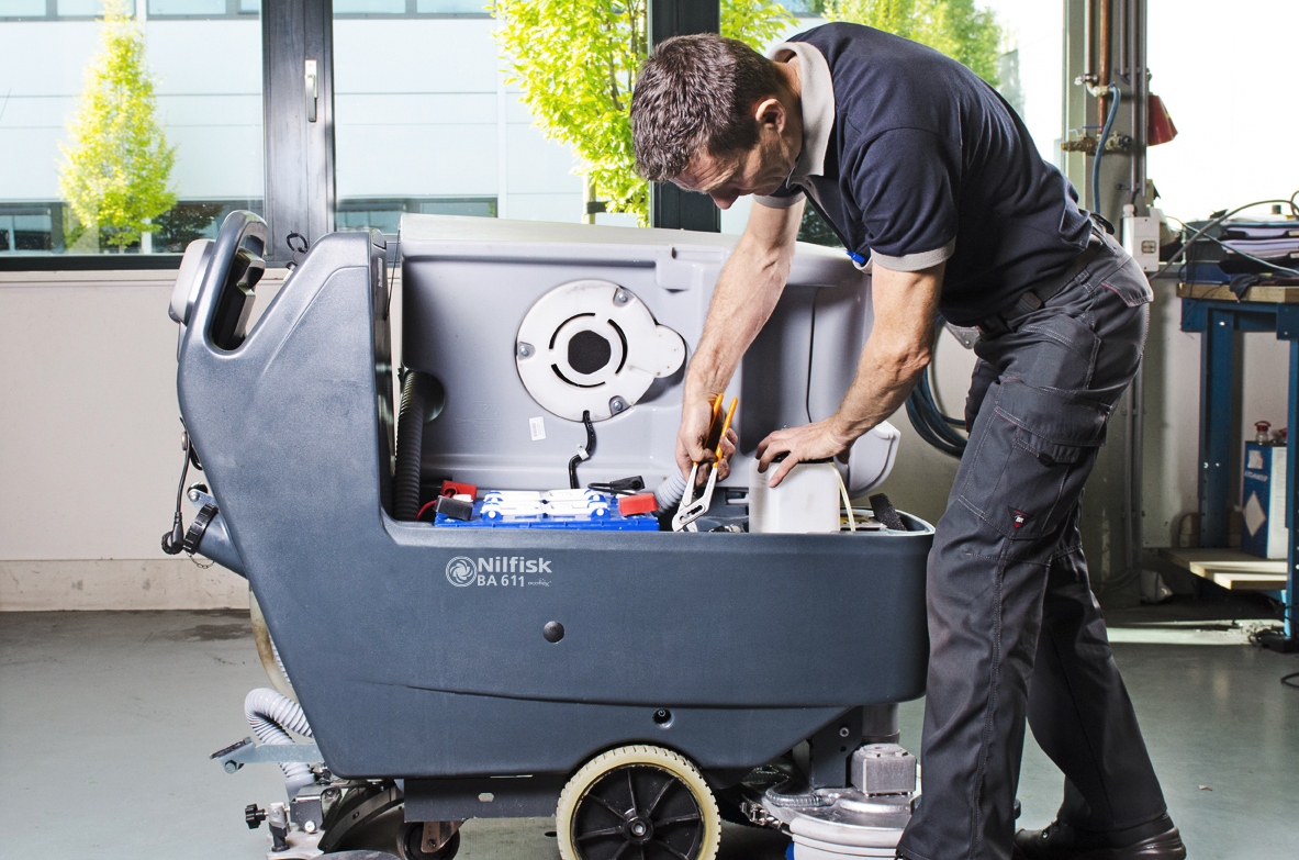 Factory‑Trained Technician Servicing Commercial Floor Scrubber – Franklin Cleaning Equipment & Supply